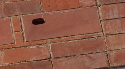 Red brick bird box integrated into the red brick facade on zero carbon house Birmingham