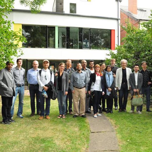 Visitors from Birmingham City University in the garden of zero carbon house, Birmingham