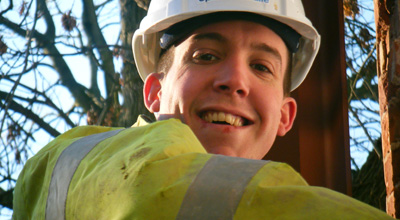 Close up of Speller Metcalfe contractor at zero carbon house Birmingham with high viz jacket and hard hat