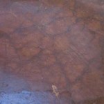 Close up of the rammed earth floor at zero carbon house, Birmingham showing the cracks and the wabi-sabi philosophy