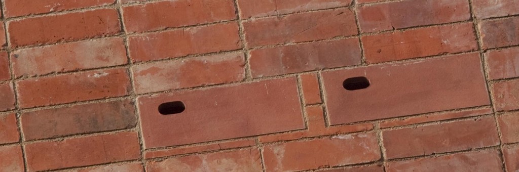 Close up of red brick homes for birds integrated onto the front of zero carbon house, Birmingham