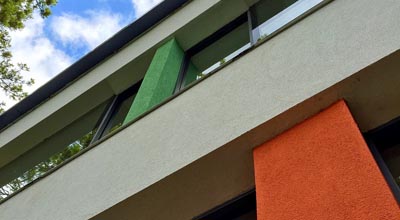 The rear of zero carbon house, Birmingham showing the windows and render