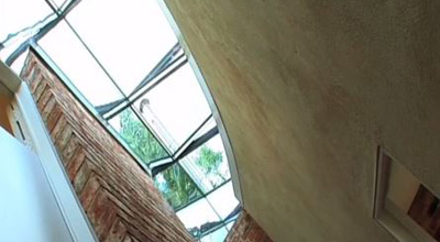 The glass roof, seen from below, with light streaming in at zero carbon house. Birmingham