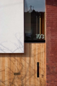 Front door of zero carbon house, Birmiingham with letter box and 103 etched into the glass skylight