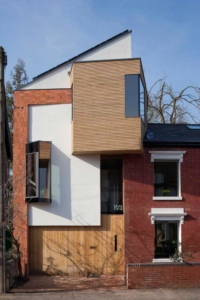 The oriel and dormer  windows on the front of zero carbon house Birmingham