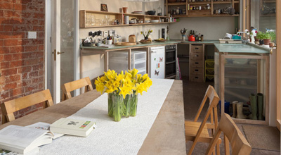 Daffodils on the table in the living room of zero carbon house Birmingham