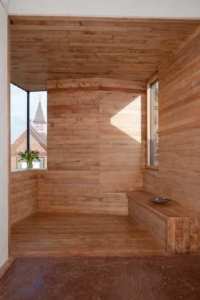 The alcove in the Long room at zero carbon house. Birmingham lined with reclaimed Canadian Honeydew maple